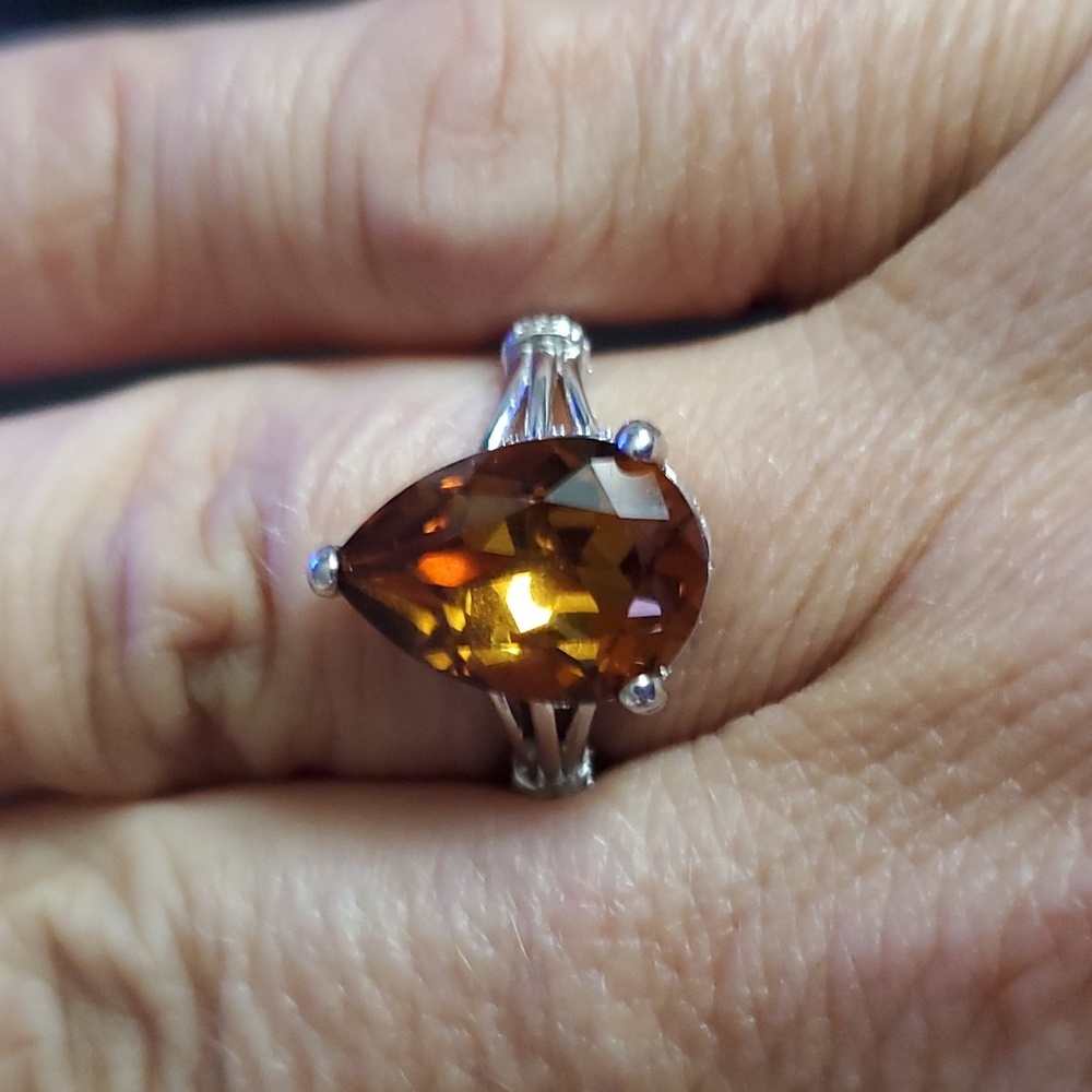 STERLING SWAROVSKI SILVER WITH AMBER COLORED STONE SZ 8